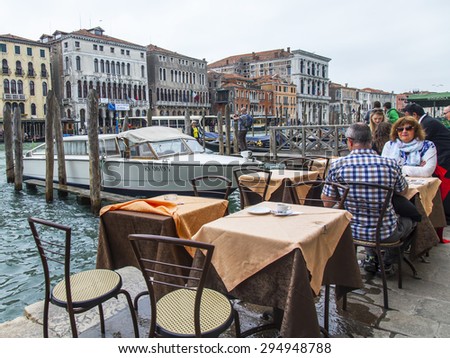 VENICE, ITALY - on MAY 3, 2015. Summer cafe on the bank of the Grand channel (Canal Grande)
