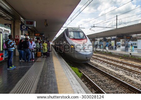 BOLOGNA, ITALY, on MAY 2, 2015. Passengers expect arrival of the train on the platform of the Central station