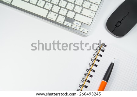blank notebook and keyboard in the office