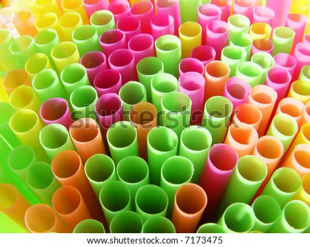 close-up many cocktail straws pink green orange