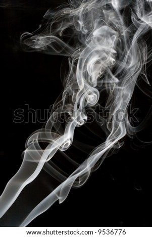 white smoke rising up with black background
