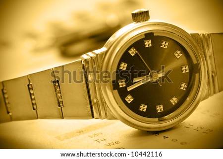 sepia tint watch time concept with calendar