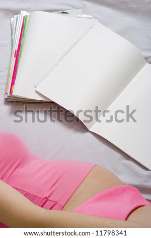 young adult woman reading blank pages journal