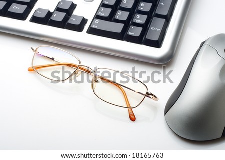 keyboard mouse and glasses on white background