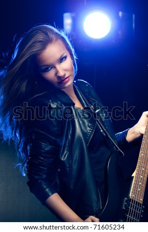 blonde woman rock star portrait with guitar