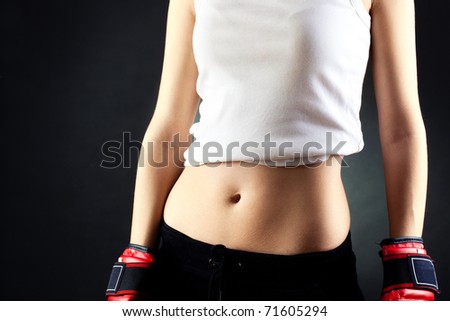 young woman wearing red boxer gloves no head