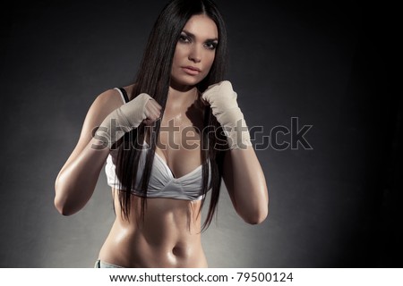 beautiful woman boxer portrait wearing bandage on hands