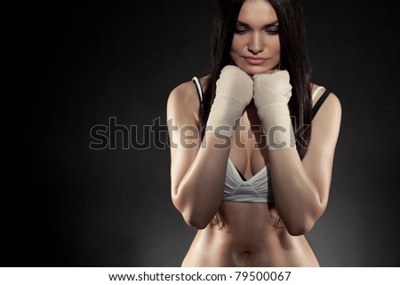 beautiful woman boxer portrait wearing bandage on hands