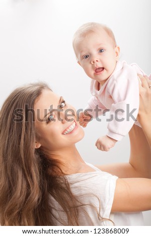 beautiful brunette woman holding fingers on her neck beautiful brunette woman holding fingers on her neck
