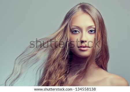 beautiful woman face portrait with flying hair