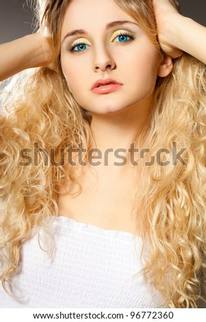closeup woman portrait with hands on head