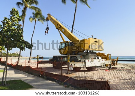 HONOLULU - MAY 11: Construction equipment parked on the beach during a renovation one of the world\'s most famous beaches in Waikiki on May 11, 2012.