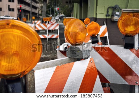 orange construction boards and flashing lights