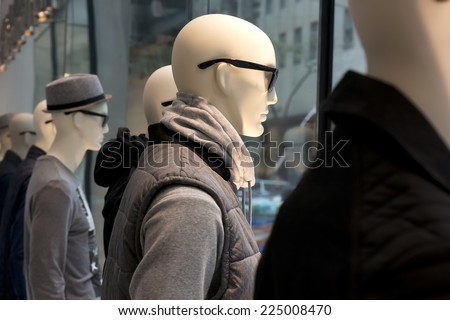 mannequins in a storefront window