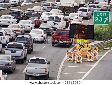 HONOLULU - JUNE 26 2013: Cars line up on the freeway due to road construction on June 26, 2013. Traffic has become a serious issue in Hawaii, as population crowds the existing infrastructure.