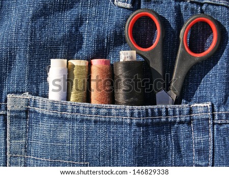 Closeup to jeans pocket with tailor tools