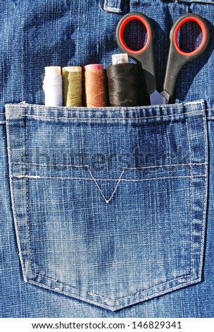 Closeup to jeans pocket with tailor tools