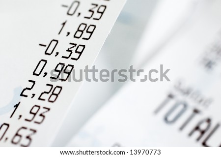 Close-up of shopping receipts with very shallow depth of field