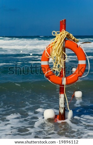 Beach life saver with rough sea in the background