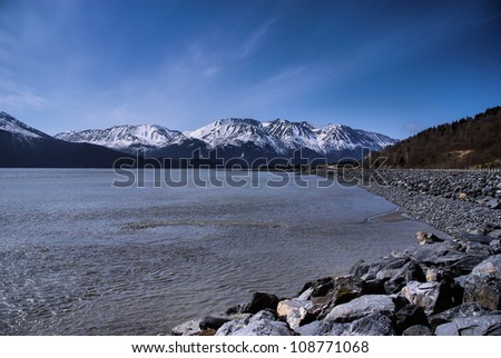 A Whirlpool Formed by the Bore Tide in the Turnagain Arm From the Seward Highway (1) Near Anchorage, Alaska.  The Great Alaskan Wilderness.  A Beautiful Landscape of Rock, Snow, Water and Ice.