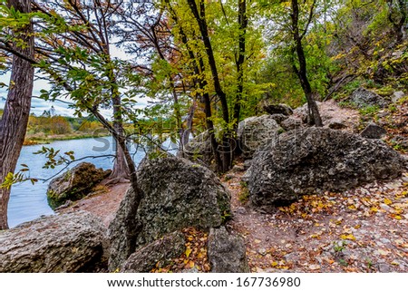 Beautiful Fall Foliage, Trails, and Boulders on the Banks of the Clear Frio River, Texas.