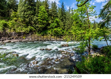The Beautiful Snoqualmie River Near the Snoqualmie Waterfall in the Great Pacific Northwest, USA.  River Basin View.