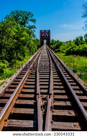 Vanishing Point View of an Old Railroad Trestle with an Old Iconic Iron Truss Bridge Over the Brazos River, Texas.