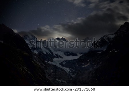 Swiss Alps, Switzerland - July 2014 - Night time view over a Swiss mountain and glacier.