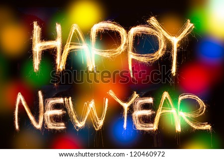 happy new year written with Sparkling figures. on bokeh background