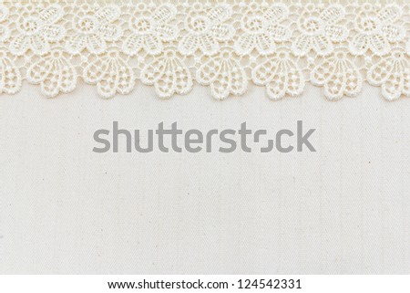 Lace flowers frame close up isolated on Fabric texture