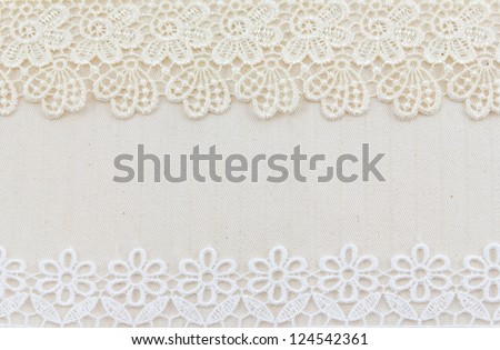 Lace flowers frame close up isolated on Fabric texture
