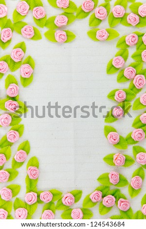 A border made of fabric flower isolated on a white background
