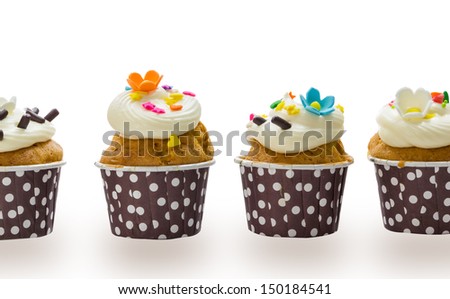 Cupcakes with cream isolate on white background