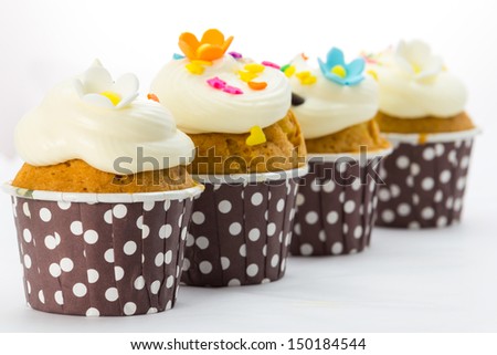 Cupcakes with cream isolate on white background
