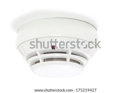 Smoke detector attached to the white ceiling