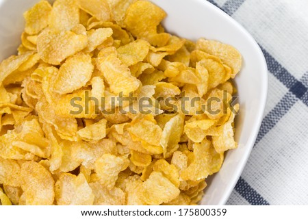 Bowl of corn flakes on table
