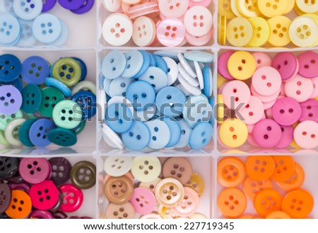 sewing buttons in collection box