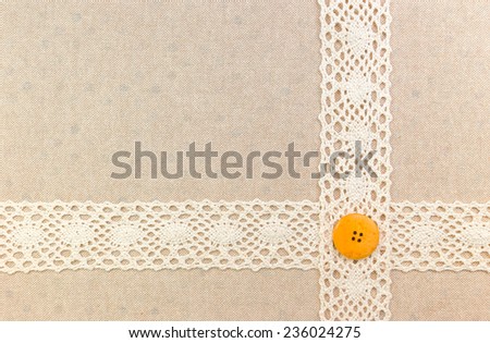 Lace border over fabric with sewing button over Fabric texture design for background