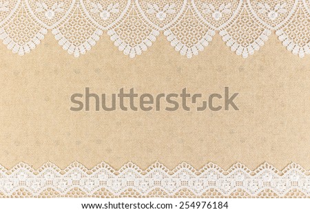 Close up of Lace flowers frame over Fabric design for border or background