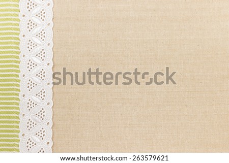 Fabric textile texture with white lace design for background