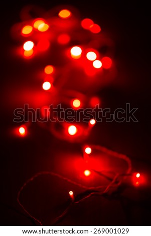 Defocused red Chrismas lights in the dark