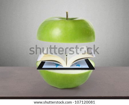 Book and tablet computer  model and green  apple