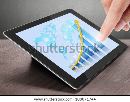 holding touch screen tablet and shows tablet in hand With graph