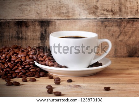 cup of coffee white cup on wooden background
