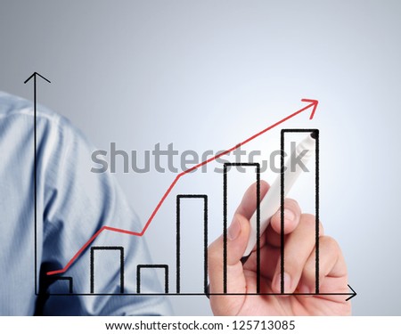 Business man drawing a graph