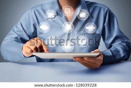 touch screen tablet and shows tablet in hand