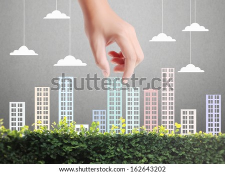 Building in a hand businessmen Building in a hand businessmen