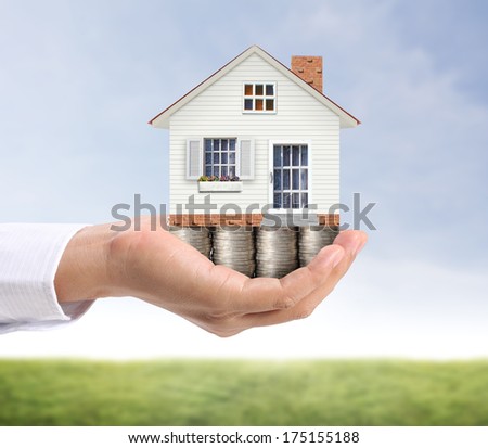 Holding House Representing Home Ownership And The Real Estate Business