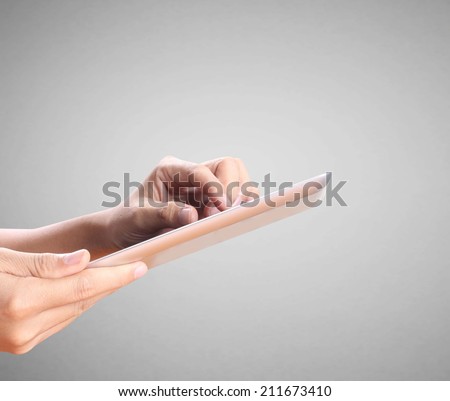 man using tablet ,finger touching screen of a digital tablet