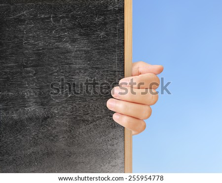 man holding blank chalkboard in the hand